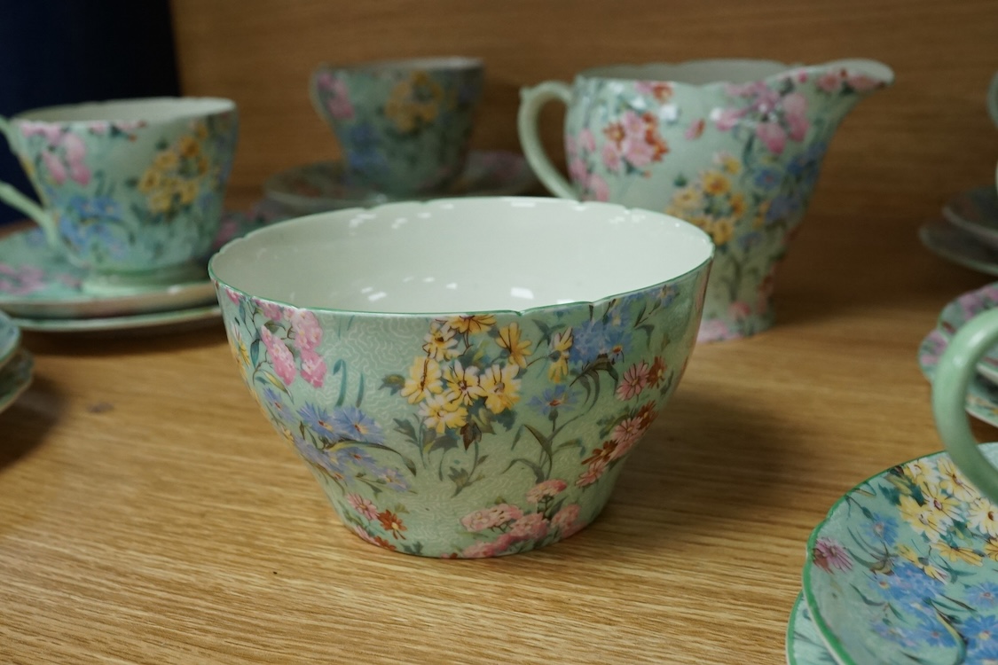 A Shelley ‘Melody’ porcelain six cup tea set, teapot missing, cake plate 25cm square (21)